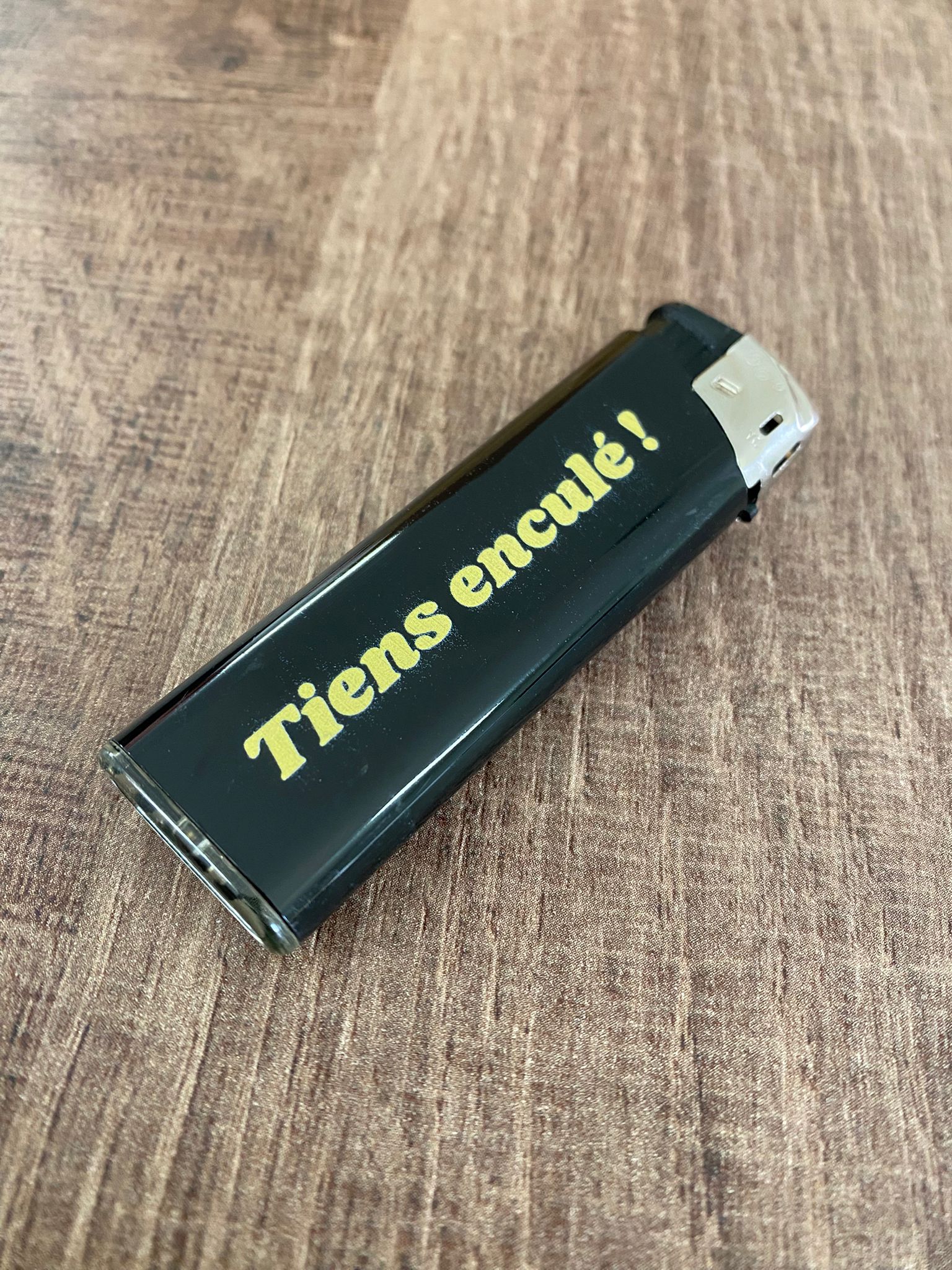 BRIQUET "TIENS ENC*LÉ !"