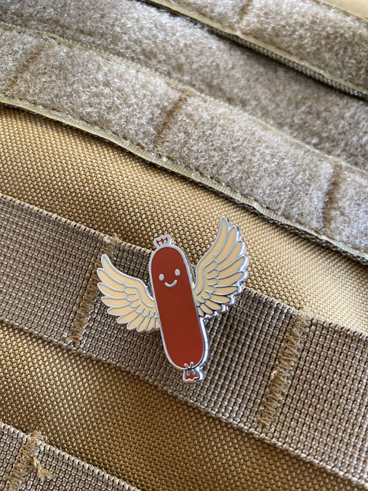 PIN'S SAUCISSE VOLANTE